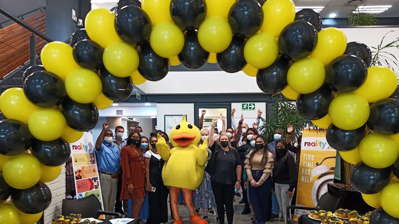You are currently viewing Employees welcomed with Reality’s bubbly yellow Mascot, cupcakes and lively music, followed by information sessions.